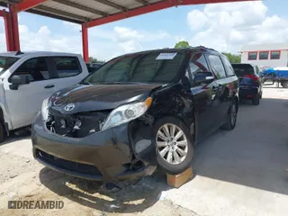2014 Toyota Sienna XLE with VIN 5TDYK3DC2ES423847, listed as a IAAI auction lot 40001988 with 130,731 mi miles. Bid and sale history available at carsss.com. Image 2.
