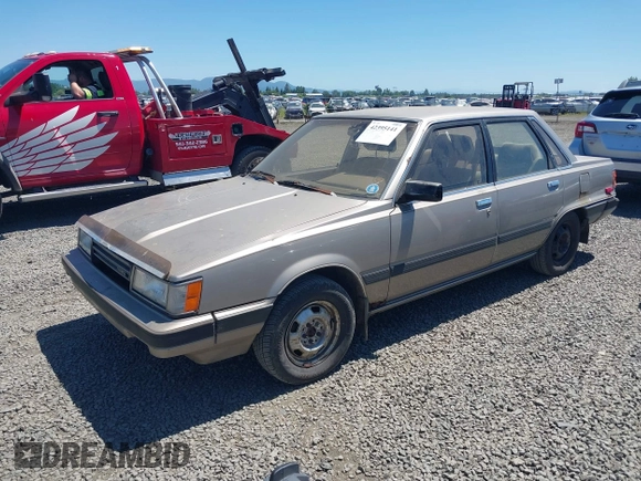 1986 Toyota Camry z VIN JT2SV16E1G0439200, wystawiony jako IAAI lot #42395141 z przebiegiem 159 698 mil mil oraz . Historia ofert i sprzedaży dostępna na DreamBid. Obrazek 2.