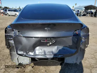 2024 Tesla Model Y with VIN 7SAYGDED3RF151031, listed as a Copart auction lot 49494165 with 7,503 mi miles and Salvage Title. Bid and sale history available at DreamBid. Image 6.