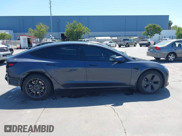 2023 Tesla Model 3 with VIN 5YJ3E1EAXPF405588, listed as a IAAI auction lot 42348952 with 30,788 mi miles and . Bid and sale history available at DreamBid. Image 14.
