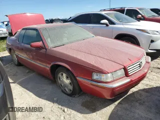 2000 Cadillac Eldorado z VIN 1G6EL12Y7YU198685, wystawiony jako Copart lot #75093094 z przebiegiem Nie podano mil oraz Szkody całkowita. Historia ofert i sprzedaży dostępna na DreamBid. Obrazek 4.