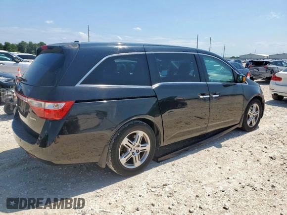 2011 Honda Odyssey Touring with VIN 5FNRL5H90BB033700, listed as a Copart auction lot 58602835 with 197,063 mi miles and Clean title. Bid and sale history available at DreamBid. Image 3.