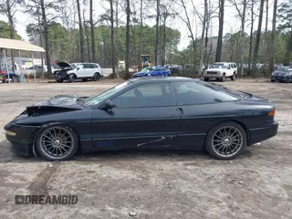 1995 Ford Probe z VIN 1ZVLT22B1S5104093, wystawiony jako IAAI lot #41744654 z przebiegiem 166 253 mil mil oraz . Historia ofert i sprzedaży dostępna na DreamBid. Obrazek 14.