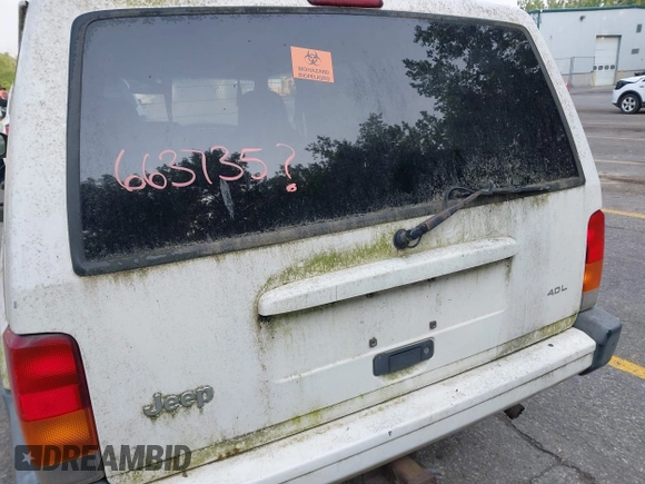 1999 Jeep Cherokee Sport z VIN 1J4FF68S0XL663735, wystawiony jako IAAI lot #42463562 z przebiegiem Nie podano mil oraz . Historia ofert i sprzedaży dostępna na DreamBid. Obrazek 14.