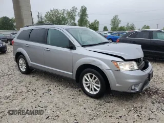 2017 Dodge Journey SXT with VIN 3C4PDCBB0HT545567, listed as a Copart auction lot 57766105 with 56,569 mi miles and Salvage title. Bid and sale history available at DreamBid. Image 4.