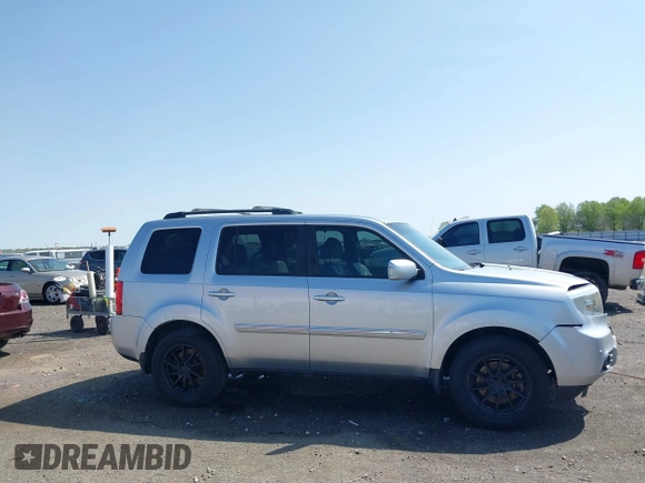 2013 Honda Pilot Touring with VIN 5FNYF3H95DB032438, listed as a IAAI auction lot 41865938 with 298,973 mi miles and . Bid and sale history available at DreamBid. Image 13.