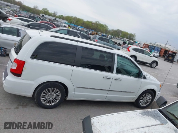 2015 Chrysler Town & Country Touring-L with VIN 2C4RC1CG9FR573863, listed as a IAAI auction lot 42036034 with 141,390 mi miles. Bid and sale history available at carsss.com. Image 13.