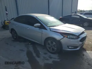 2017 Ford Focus SE with VIN 1FADP3FE9HL273889, listed as a Copart auction lot 53737055 with 114,700 mi miles and Salvage Title. Bid and sale history available at DreamBid. Image 4.