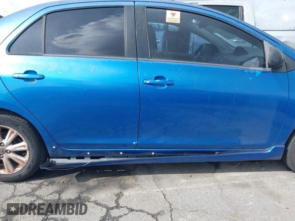 2009 Toyota Yaris with VIN JTDBT903591323255, listed as a IAAI auction lot 41933401 with 88,558 mi miles and . Bid and sale history available at DreamBid. Image 13.