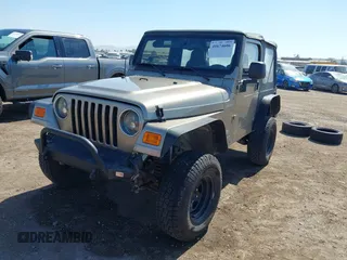 2005 Jeep Wrangler Sport with VIN 1J4FA49S65P342497, listed as a IAAI auction lot 41674606 with 123,457 mi miles. Bid and sale history available at carsss.com. Image 17.