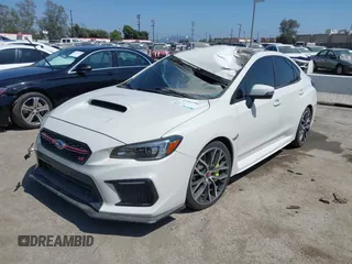 2019 Subaru WRX STI z VIN JF1VA2R6XK9814201, wystawiony jako IAAI lot #41641582 z przebiegiem 57 327 mil mil oraz . Historia ofert i sprzedaży dostępna na DreamBid. Obrazek 2.