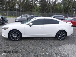 2017 Mazda 6 Grand Touring with VIN JM1GL1X51H1142473, listed as a IAAI auction lot 42234809 with 101,633 mi miles and . Bid and sale history available at DreamBid. Image 15.