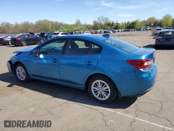 2018 Subaru Impreza Premium with VIN 4S3GKAD63J3605854, listed as a Copart auction lot 54986795 with 59,119 mi miles and Salvage title. Bid and sale history available at DreamBid. Image 2.