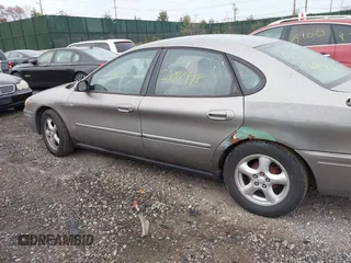 2004 Ford Taurus SE z VIN 1FAFP53U74A135287, wystawiony jako IAAI lot #40756396 z przebiegiem 141 483 mil mil oraz . Historia ofert i sprzedaży dostępna na DreamBid. Obrazek 6.