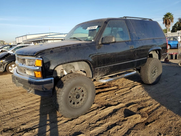 1998 Chevrolet Tahoe with VIN 3GNEK18R6WG102052, listed as a Copart auction lot 77485244 with 187,542 mi miles and Salvage Title. Bid and sale history available at carsss.com. Image 1.