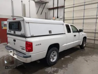 2009 Dodge Dakota Bighorn/Lonestar with VIN 1D3HW32P79S819674, listed as a IAAI auction lot 41962369 with 157,399 mi miles and . Bid and sale history available at carsss.com. Image 4.