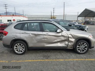 2015 BMW X1 xDrive28i with VIN WBAVL1C55FVY41749, listed as a IAAI auction lot 40977221 with 120,924 mi miles. Bid and sale history available at carsss.com. Image 6.