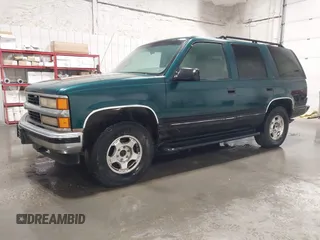 1996 Chevrolet Tahoe z VIN 1GNEK13R4TJ417000, wystawiony jako IAAI lot #41992121 z przebiegiem 166 215 mil mil oraz . Historia ofert i sprzedaży dostępna na DreamBid. Obrazek 2.