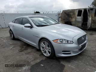 2014 Jaguar XJ Portfolio with VIN SAJWJ2GD2E8V62696, listed as a Copart auction lot 76620494 with 85,487 mi miles and Salvage title. Bid and sale history available at DreamBid. Image 4.