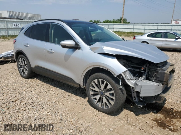 2020 Ford Escape Titanium with VIN 1FMCU9J98LUA78182, listed as a Copart auction lot 60477635 with 76,117 mi miles and Salvage title. Bid and sale history available at DreamBid. Image 4.