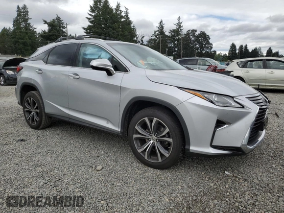 2016 Lexus RX 350 with VIN JTJBZMCA5G2005796, listed as a Copart auction lot 64453905 with 69,784 mi miles and Salvage title. Bid and sale history available at DreamBid. Image 4.