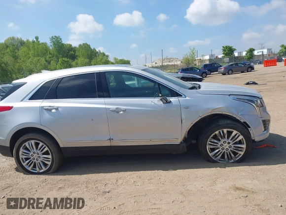 2017 Cadillac XT5 Premium Luxury AWD z VIN 1GYKNERS6HZ112170, wystawiony jako IAAI lot #42262116 z przebiegiem 140 982 mil mil oraz . Historia ofert i sprzedaży dostępna na DreamBid. Obrazek 13.