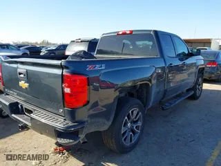 2017 Chevrolet Silverado 1500 LT with VIN 1GCVKRECXHZ154083, listed as a IAAI auction lot 41216478 with 153,599 mi miles. Bid and sale history available at carsss.com. Image 4.