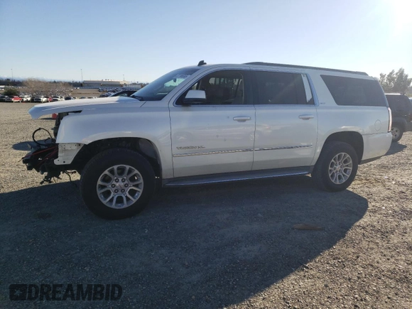 2015 GMC Yukon XL SLT with VIN 1GKS1HKC2FR130964, listed as a Copart auction lot 87796695 with 173,020 mi miles and Salvage Title. Bid and sale history available at carsss.com. Image 1.