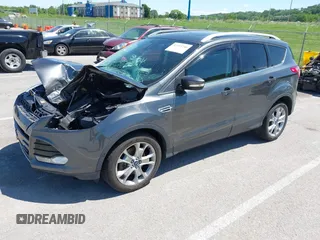 2015 Ford Escape Titanium z VIN 1FMCU9J92FUB01007, wystawiony jako IAAI lot #42319246 z przebiegiem 90 782 mil mil oraz . Historia ofert i sprzedaży dostępna na DreamBid. Obrazek 18.