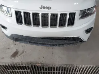2014 Jeep Grand Cherokee Laredo with VIN 1C4RJFAG4EC309401, listed as a IAAI auction lot 41996233 with 243,541 mi miles and . Bid and sale history available at DreamBid. Image 6.