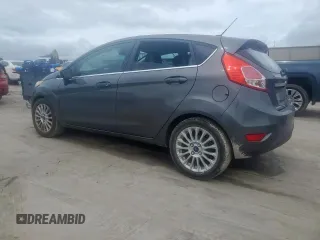 2015 Ford Fiesta Titanium z VIN 3FADP4FJ5FM203174, wystawiony jako Copart lot #60727515 z przebiegiem 91 898 mil mil oraz Czysty tytuł • Clean title. Historia ofert i sprzedaży dostępna na DreamBid. Obrazek 2.