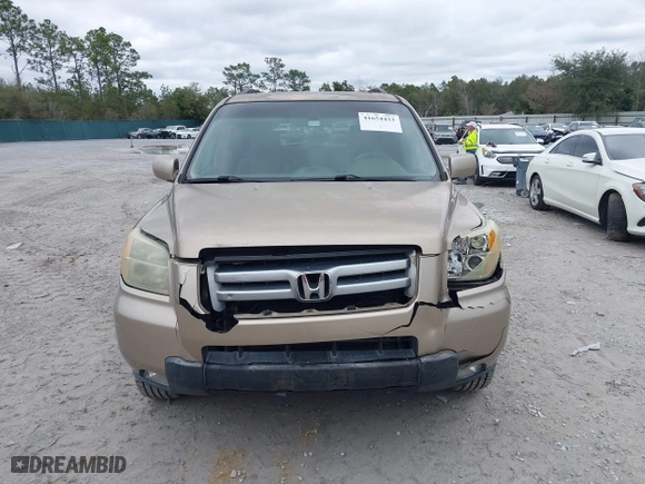 2006 Honda Pilot EX-L with VIN 5FNYF28566B010295, listed as a IAAI auction lot 41654433 with 302,539 mi miles. Bid and sale history available at carsss.com. Image 12.