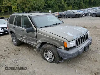 1996 Jeep Grand Cherokee Laredo with VIN 1J4GZ58S7TC403946, listed as a Copart auction lot 71785734 with 231,780 mi miles and Salvage Title. Bid and sale history available at carsss.com. Image 4.