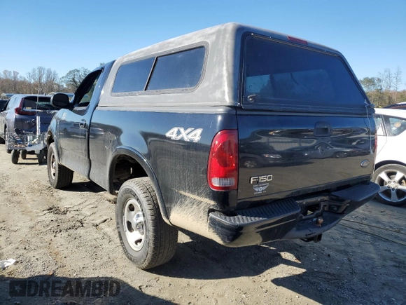 2002 Ford F-150 XL with VIN 1FTRF18232NA58109, listed as a Copart auction lot 79080674 with 148,213 mi miles and Salvage title. Bid and sale history available at DreamBid. Image 2.