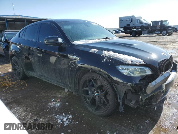 2014 BMW X6 M with VIN 5YMGZ0C50E0C40694, listed as a Copart auction lot 43943305 with 124,104 mi miles and Salvage Title. Bid and sale history available at carsss.com. Image 4.