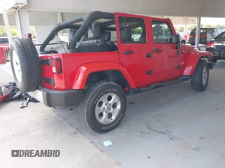 2014 Jeep Wrangler Unlimited Sahara z VIN 1C4BJWEGXEL179054, wystawiony jako IAAI lot #42151597 z przebiegiem 151 810 mil mil oraz . Historia ofert i sprzedaży dostępna na DreamBid. Obrazek 4.