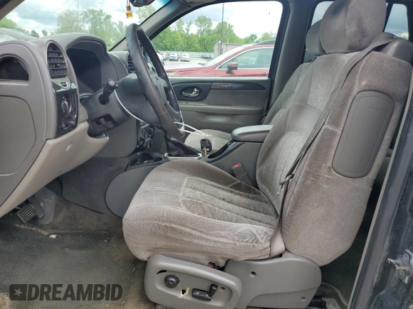 2003 GMC Envoy SLE z VIN 1GKDT13S432160651, wystawiony jako Copart lot #56938205 z przebiegiem 197 593 mil mil oraz Szkoda całkowita • Salvage title. Historia ofert i sprzedaży dostępna na DreamBid. Obrazek 7.