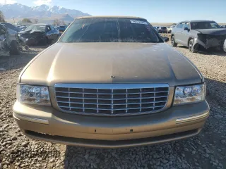 1999 Cadillac DeVille DHS z VIN 1G6KE54Y5XU721363, wystawiony jako Copart lot #79227924 z przebiegiem Nie podano mil oraz Szkoda całkowita • Salvage title. Historia ofert i sprzedaży dostępna na DreamBid. Obrazek 5.
