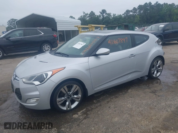 2012 Hyundai Veloster w/Black Int with VIN KMHTC6AD1CU034787, listed as a IAAI auction lot 42607847 with 126,912 mi miles and . Bid and sale history available at DreamBid. Image 2.