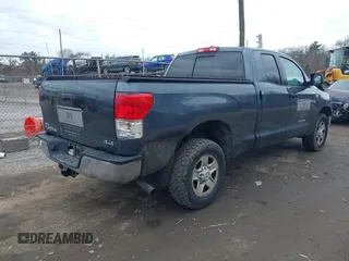 2010 Toyota Tundra with VIN 5TFUM5F16AX005232, listed as a IAAI auction lot 41688311 with 251,296 mi miles and . Bid and sale history available at DreamBid. Image 4.