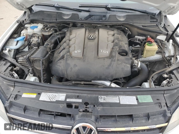 2013 Volkswagen Touareg Sport с VIN WVGEP9BP9DD003974, выставлен на аукционе Copart как лот 75106234 с пробегом 211 323 миль миль и Чистый • Clean title. История ставок и продаж доступна на DreamBid. Изображение 12.