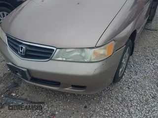2003 Honda Odyssey EX-L z VIN 5FNRL18973B122173, wystawiony jako IAAI lot #42252018 z przebiegiem 204 487 mil mil oraz . Historia ofert i sprzedaży dostępna na DreamBid. Obrazek 12.