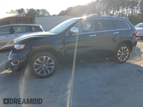2017 Jeep Grand Cherokee Overland with VIN 1C4RJFCT5HC828780, listed as a Copart auction lot 46874965 with 90,269 mi miles and Salvage Title. Bid and sale history available at carsss.com. Image 1.