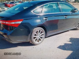 2014 Toyota Avalon Limited with VIN 4T1BK1EB4EU096164, listed as a IAAI auction lot 40904808 with 242,086 mi miles. Bid and sale history available at carsss.com. Image 4.