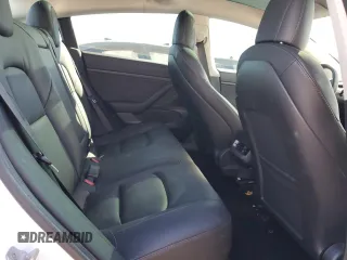 2020 Tesla Model 3 Standard Range Plus with VIN 5YJ3E1EA4LF799597, listed as a Copart auction lot 76401374 with 77,506 mi miles and Salvage Title. Bid and sale history available at DreamBid. Image 10.