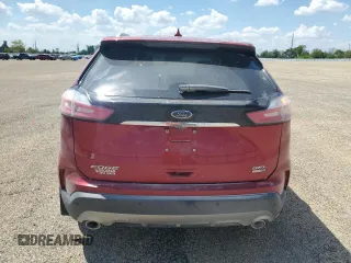 2020 Ford Edge SEL с VIN 2FMPK4J96LBA06946, выставлен на аукционе Copart как лот 56898855 с пробегом 54 984 миль миль и Списание • Salvage title. История ставок и продаж доступна на DreamBid. Изображение 6.