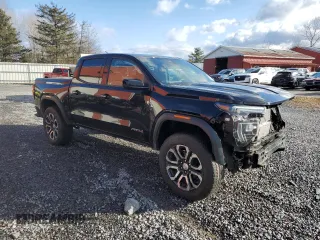2024 GMC Canyon 4WD AT4 with VIN 1GTP6DEK2R1180037, listed as a Copart auction lot 85656994 with 7,565 mi miles and Salvage Title. Bid and sale history available at carsss.com. Image 4.