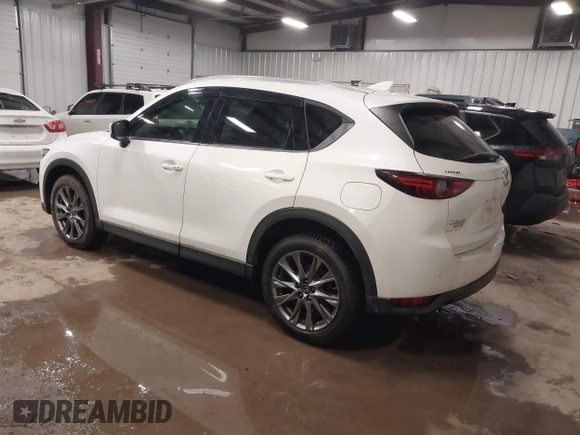 2019 Mazda CX-5 Signature with VIN JM3KFBEY5K0520593, listed as a IAAI auction lot 41638594 with 111,504 mi miles. Bid and sale history available at carsss.com. Image 3.