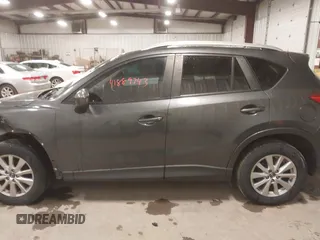2015 Mazda CX-5 Touring with VIN JM3KE4CY3F0460501, listed as a IAAI auction lot 41889743 with 160,367 mi miles. Bid and sale history available at carsss.com. Image 14.