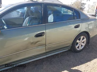 2003 Nissan Altima S with VIN 1N4AL11E63C232154, listed as a IAAI auction lot 41651258 with 235,455 mi miles. Bid and sale history available at carsss.com. Image 6.